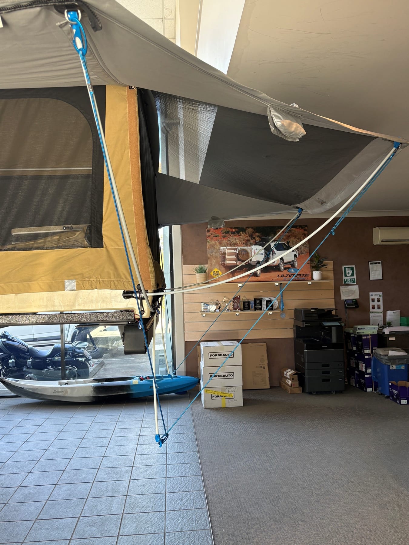 Pegless kit fitted to the camper awning with blue ropes and clips