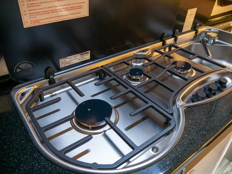 Three-burner stove and sink